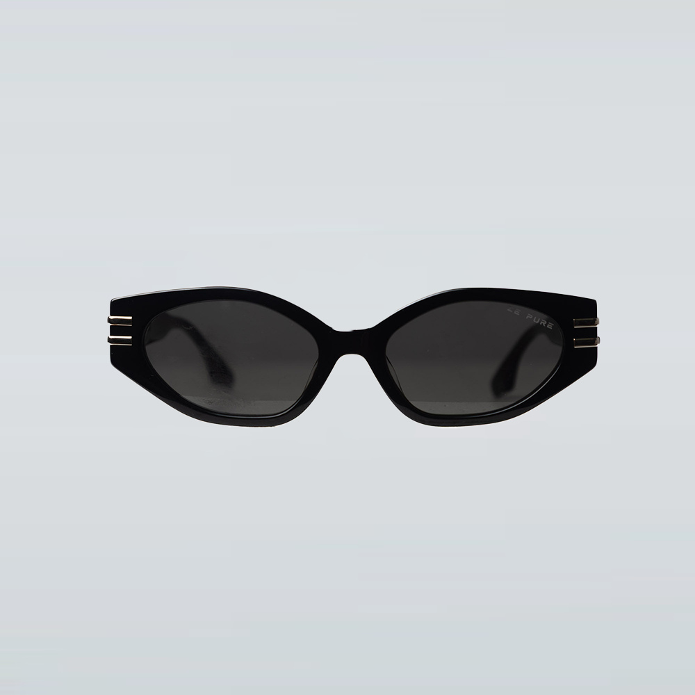 Black sunglasses with gold accents on a light gray background